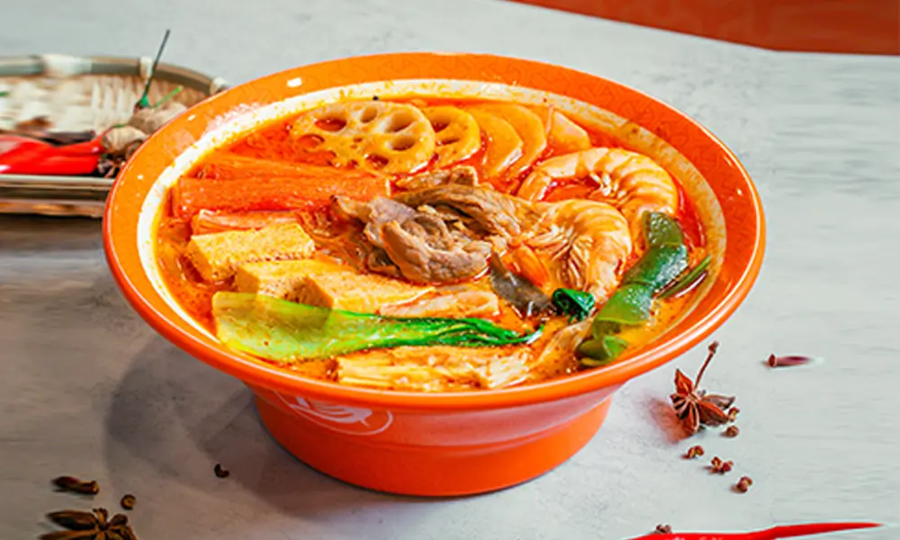 Spicy malatang with shrimp, beef, lotus root, tofu, and vegetables in herbal beef bone broth at YGF Malatang-Katy, a Chinese Restaurant in Katy