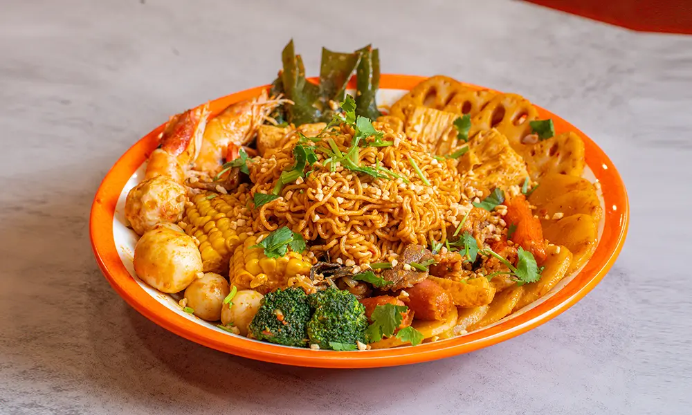 Spicy dry malatang with noodles, assorted ingredients, and sesame at YGF Malatang-Katy, a Chinese Restaurant in Katy