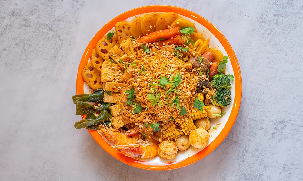 Spicy dry malatang with noodles, mixed ingredients, and sesame at YGF Malatang-Katy, a Chinese Restaurant in Katy