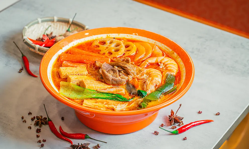 Spicy malatang with shrimp, beef, lotus root, tofu, and various veggies in herbal beef bone broth at YGF Malatang-Katy, a Chinese Restaurant in Katy