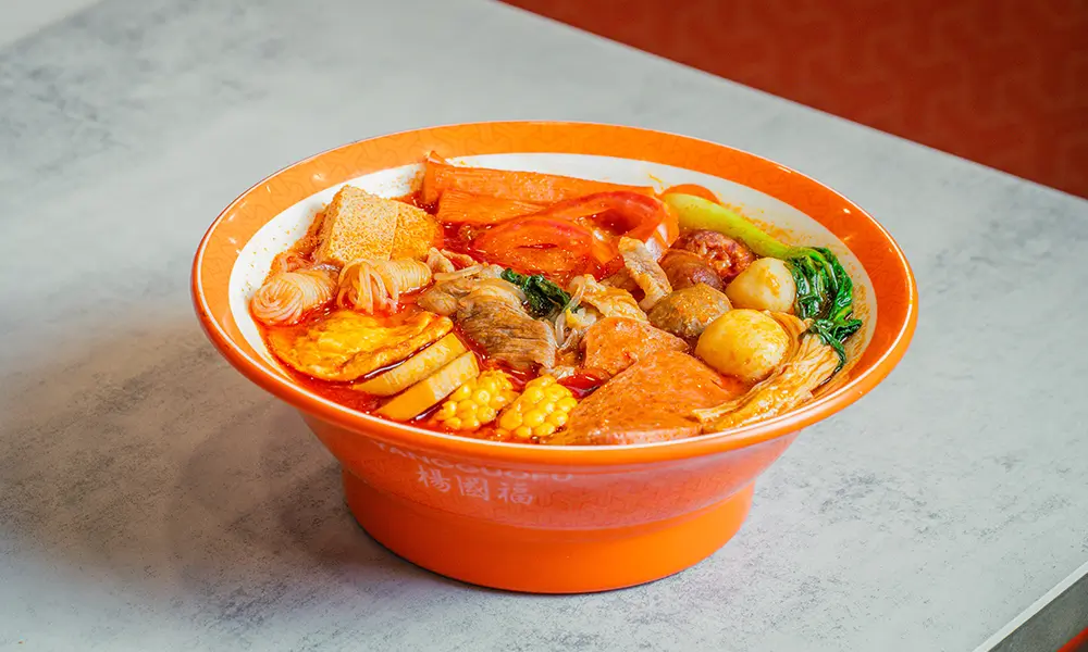 Malatang with various ingredients in sweet & sour tomato broth at YGF Malatang-Katy, a Chinese Restaurant in Katy