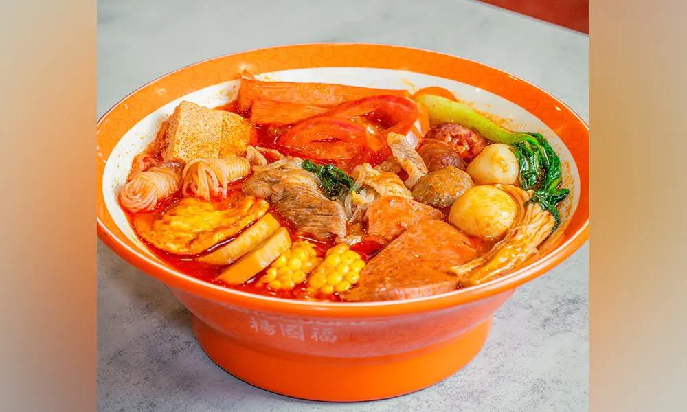 Malatang with assorted ingredients in sweet & sour tomato soup at YGF Malatang-Katy, a Chinese Restaurant in Katy