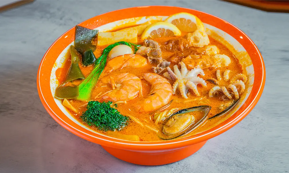 Malatang with assorted seafood, vegetables, and lemon in Tom Yum soup at YGF Malatang-Katy, a Chinese Restaurant in Katy
